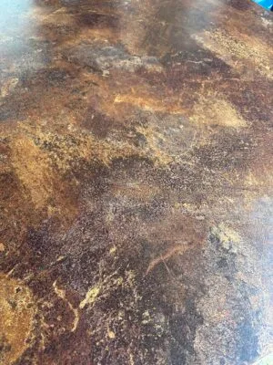 Boardroom table with copper marble finish
