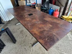 Boardroom table with copper marble finish